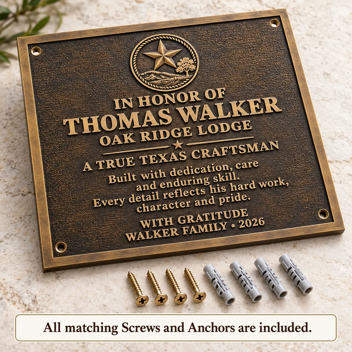 Antique bronze commemorative plaque displayed with four matching Phillips-head screws and wall anchors