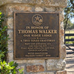 Personalised bronze plaque reading River Bend Ranch with raised longhorn emblem mounted on a stone entrance pillar